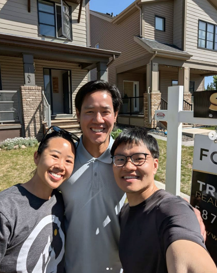 Trung bien with clients after selling their home