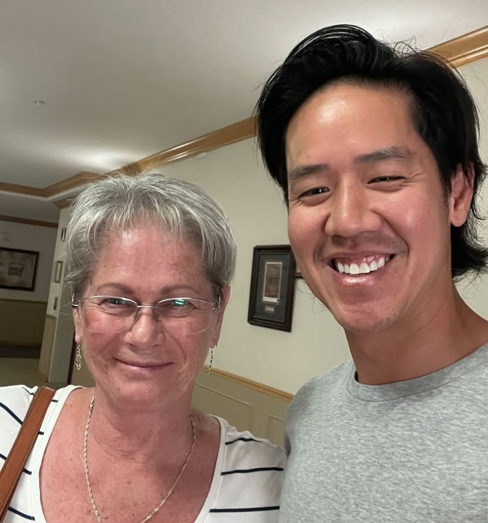 Trung Bien with client after buying their home